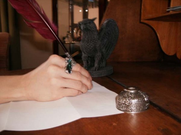 My favorite ring and my favorite writing utensil. Unfortunately the quill had an accident of the kitten variety so the feather's a bit mangled but I still love it.